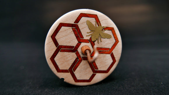 Spindle with a celtic knot style honeycomb in contrasting wood and metal inlay bee